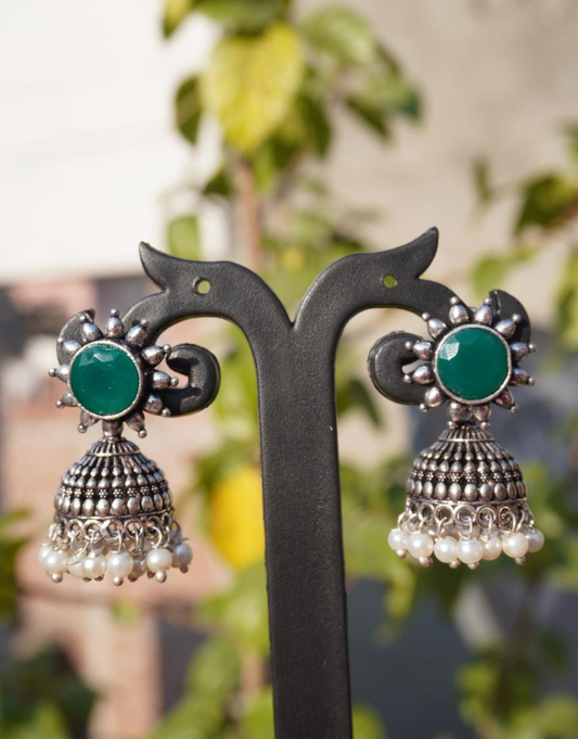Antique Silver-Finished Jhumka Earrings with Emerald Green Stone and Pearl Accents