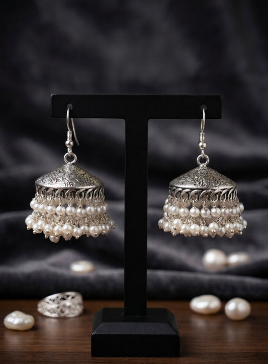 Double-Layered Pearl Oxidized Silver Jhumkas – Handcrafted Floral Engraved Earrings